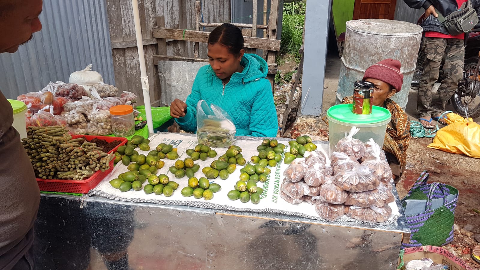Buying bettlenuts to offer the village in West Timor