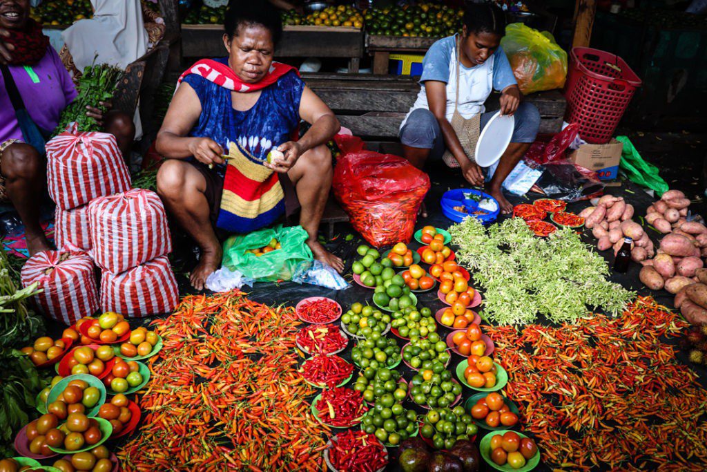 What to do in Sorong in a day woman selling fruits at the market