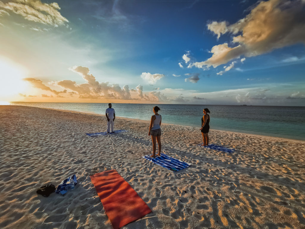 ScubaSpa liveaboard review Maldives yoga on the beach 