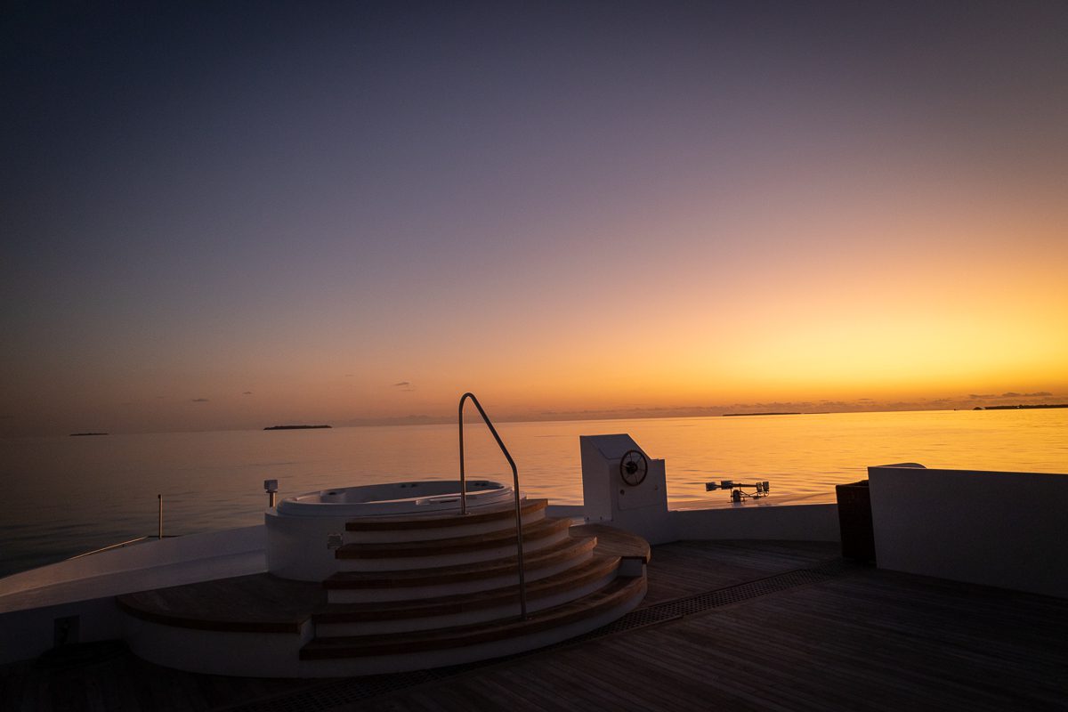 Deck jacuzzi at dusk on the Scubaspa liveaboard, a luxury way of diving in the Maldives