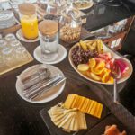 Breakfast buffet of juice, cereals, fruit and cold cuts