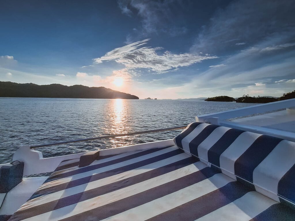 The 7 Best Luxury Raja Ampat Liveaboards (Tested & Reviewed) Luxury Raja Ampat liveaboard sailing through karst islands