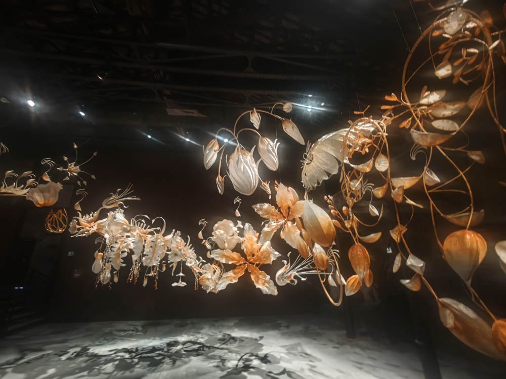 Hanging organic sculpture suspended in a darkened Venice Biennale installation