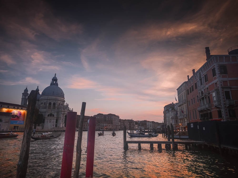 Sunset over the Grand Canal and Santa Maria della Salute, looking west across the water in Venice