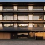 The Kyoto Hotel That Comes With Its Own Geisha Theatre Capella Kyoto exterior with timber lattice screens and deep eaves in the Miyagawa-cho geisha district