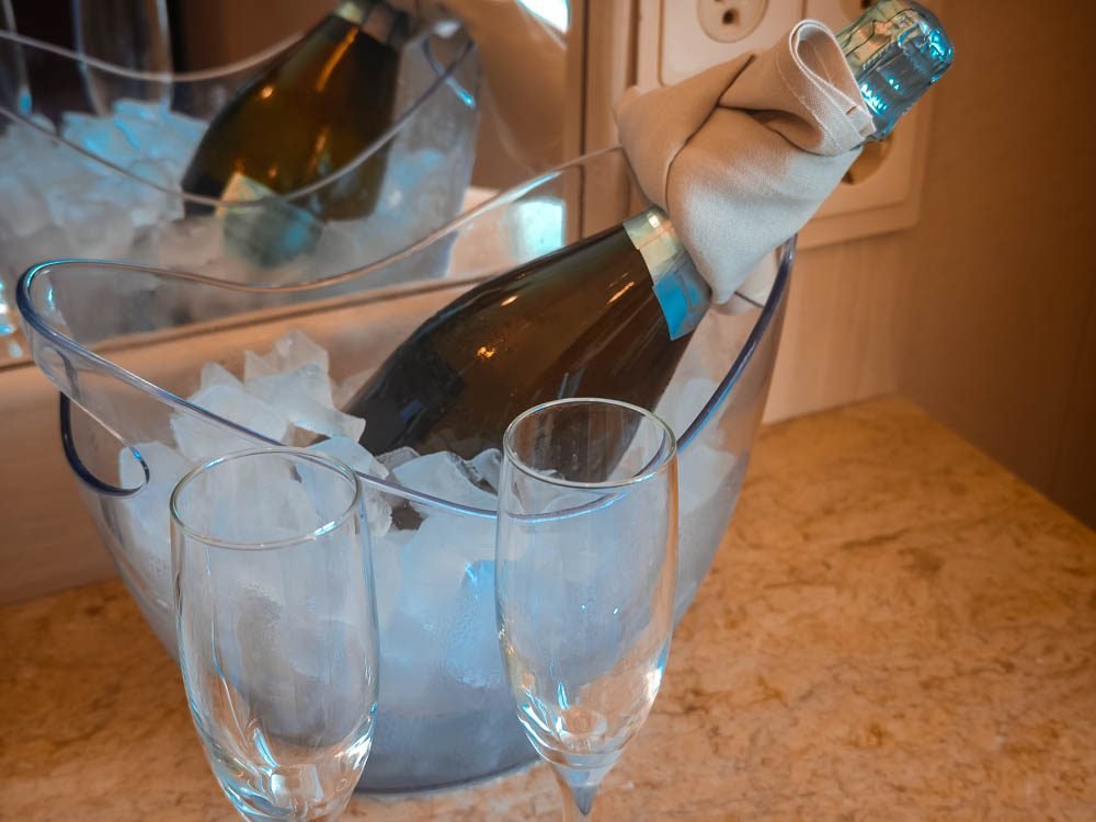 Welcome sparkling wine in an AquaClass cabin on Celebrity Constellation