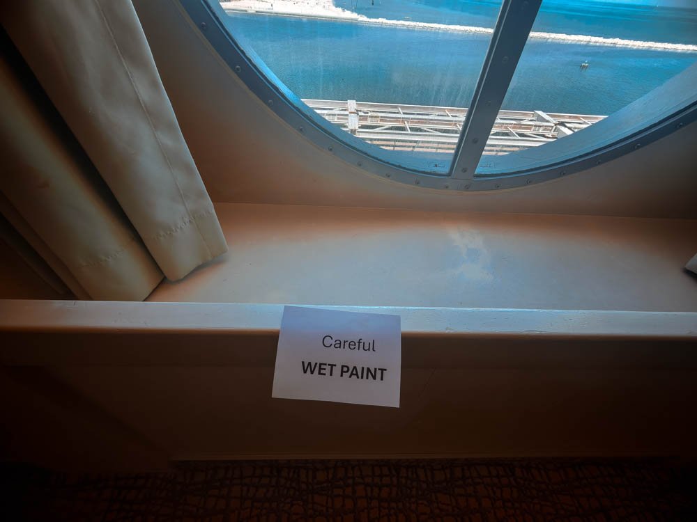 Wet paint warning sign inside a cabin on Celebrity Constellation