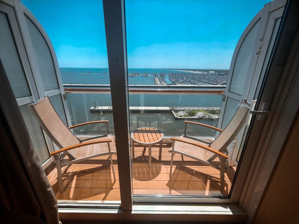 Veranda of an AquaClass cabin on Celebrity Constellation seen through the balcony doors