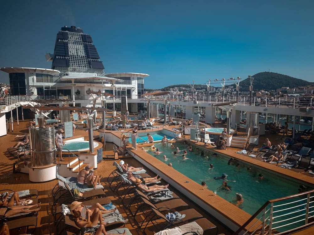 Crowded pool deck on Celebrity Constellation on a sea day