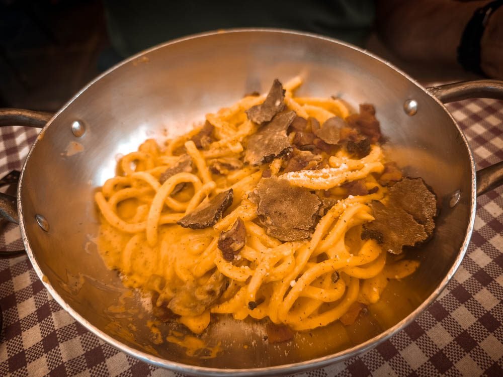 Pan of tagliatelle with truffle served in an Italian trattoria ashore