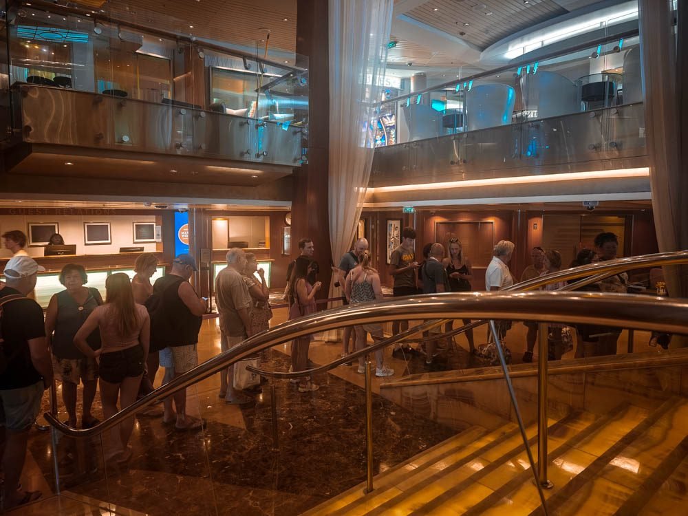Passengers gathered in the Grand Foyer of Celebrity Constellation