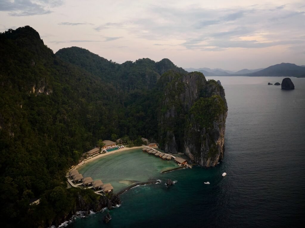 Aerial view of El Nido Lagen Island Resort private island with overwater villas, Palawan Philippines