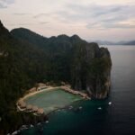 El Nido Lagen Cut Nine Rooms to Get Its Beach Back Aerial view of El Nido Lagen Island Resort private island with overwater villas, Palawan Philippines