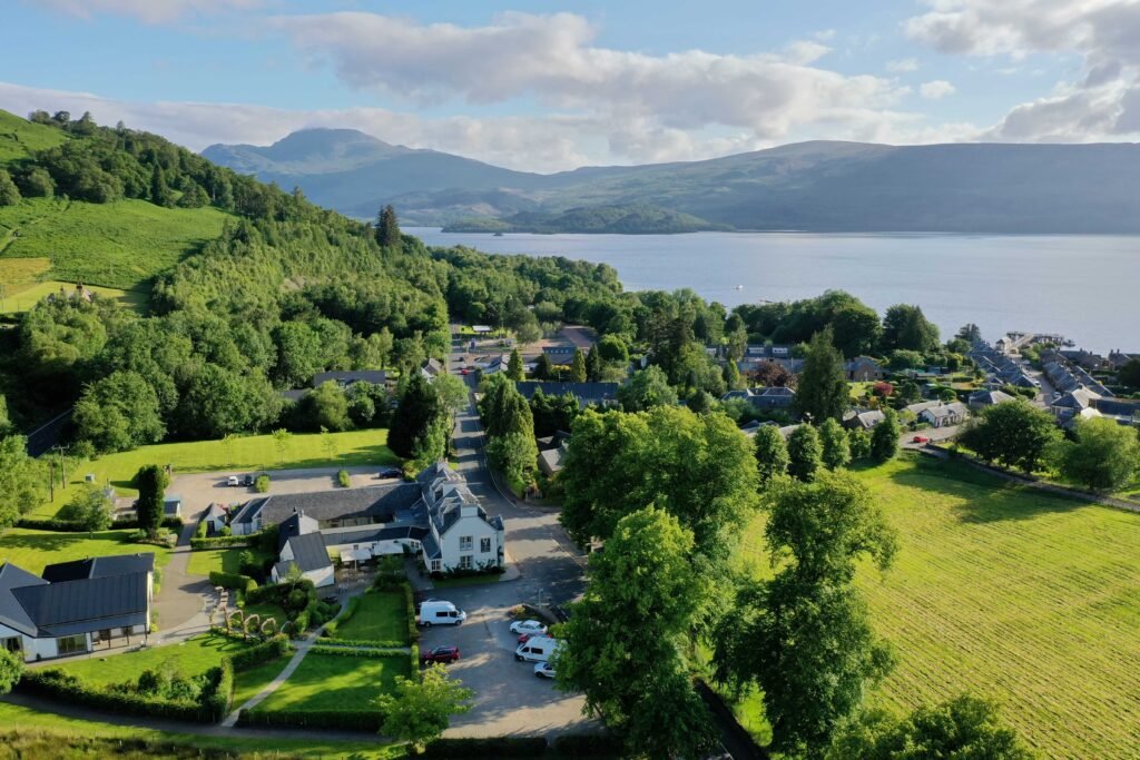 Aerial view of The Loch Lomond Arms and the village of Luss on the west shore of Loch Lomond