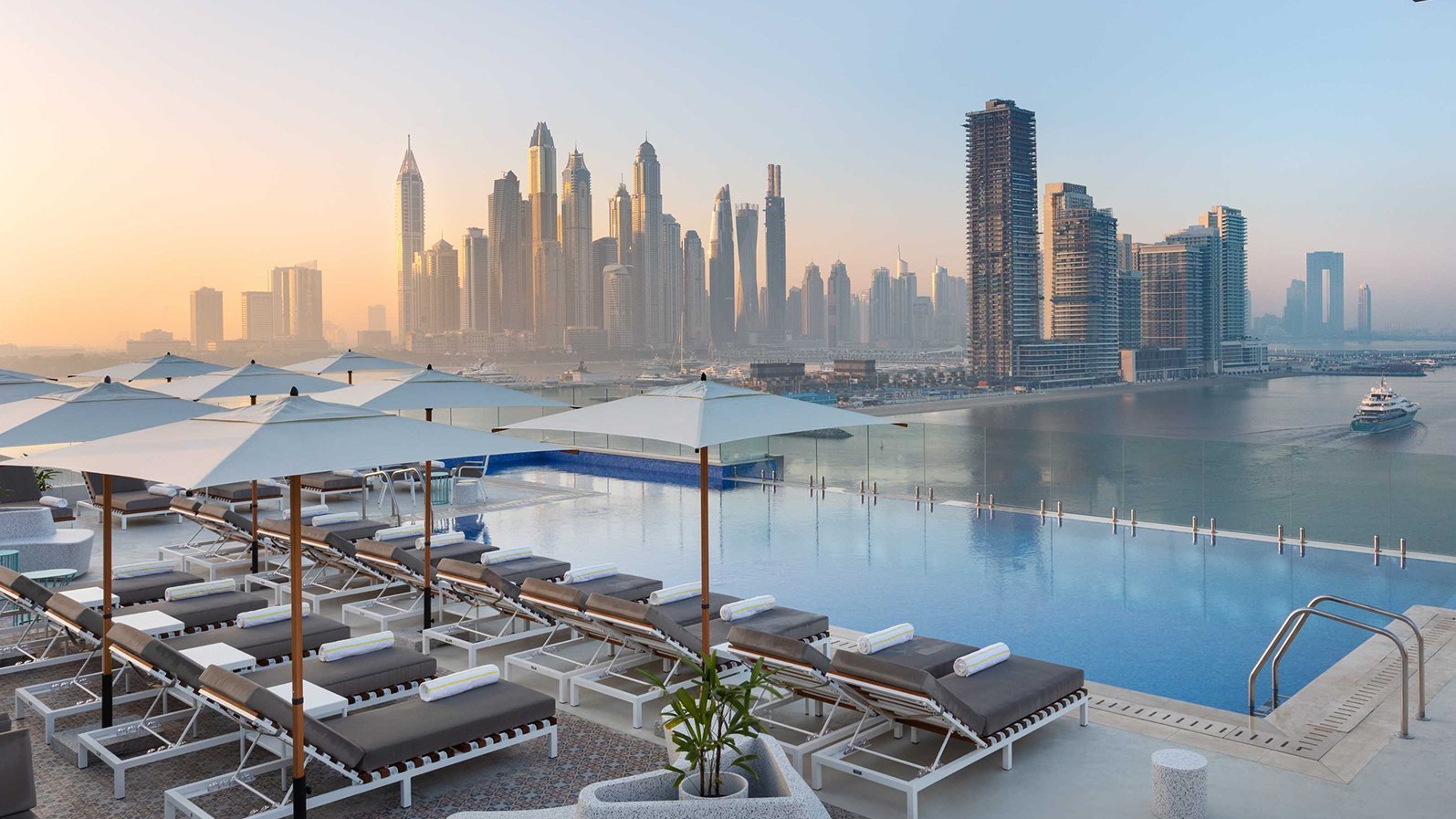 Pool and Dubai skyline at Six Senses The Palm Dubai
