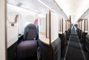 Air Canada A321XLR Signature Class suites in a 1-1 layout, looking down the cabin aisle