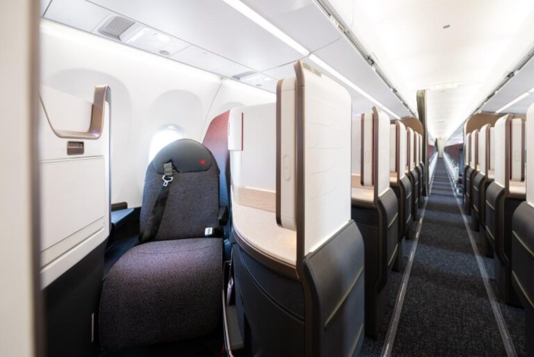 Fourteen Lie-Flat Seats in a Row of One: Air Canada's A321XLR Takes Signature Class Across the Atlantic Air Canada A321XLR Signature Class suites in a 1-1 layout, looking down the cabin aisle