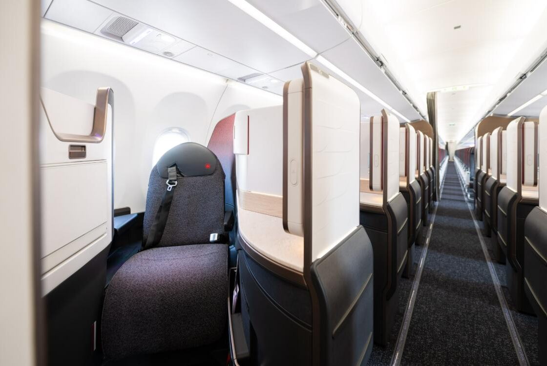 Air Canada A321XLR Signature Class suites in a 1-1 layout, looking down the cabin aisle