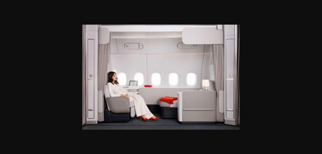 Air France La Première suite on the Boeing 777-300ER, showing the reclining armchair, the separate chaise longue and five windows