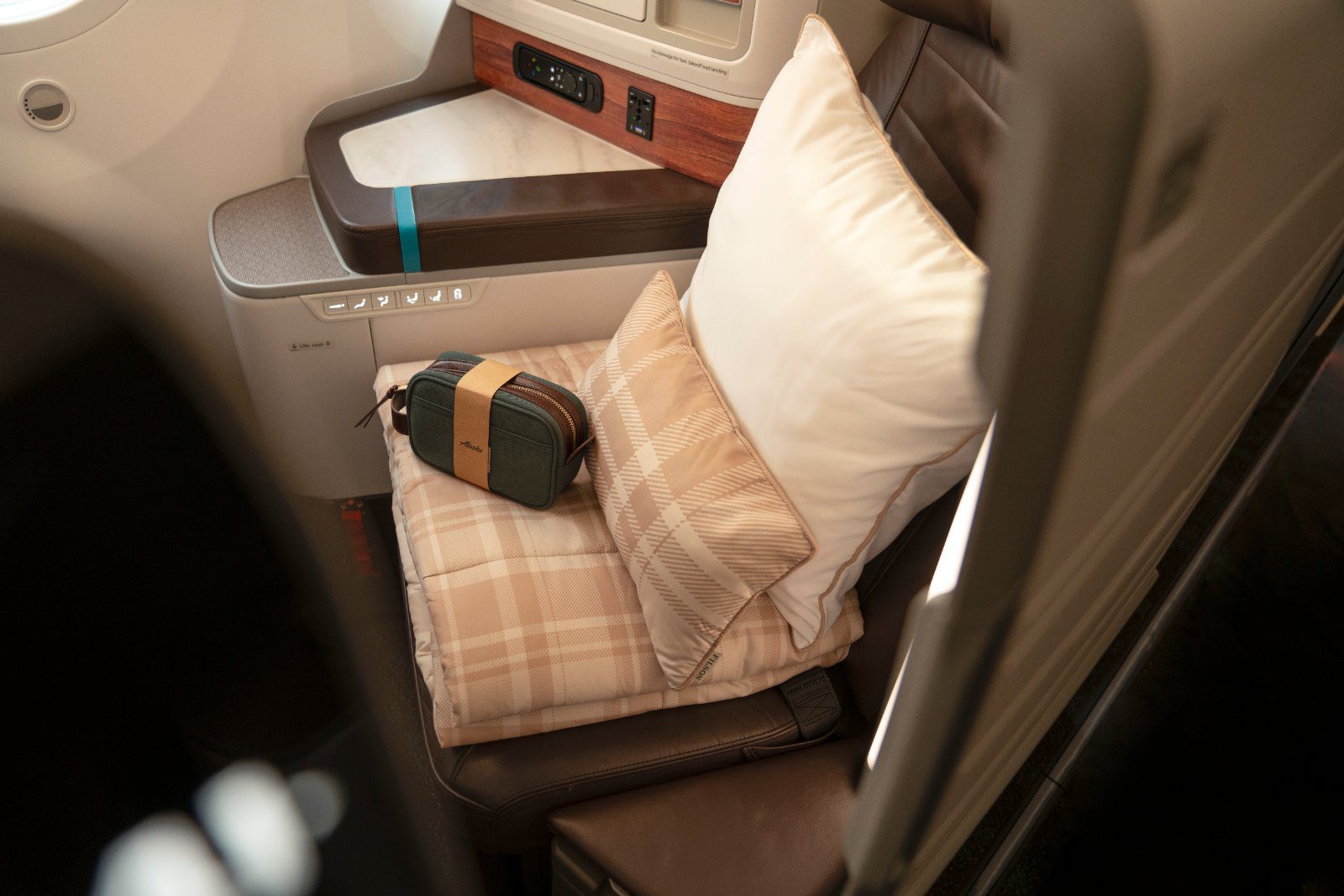 Alaska Airlines business class suites seat and side console on the Boeing 787-9