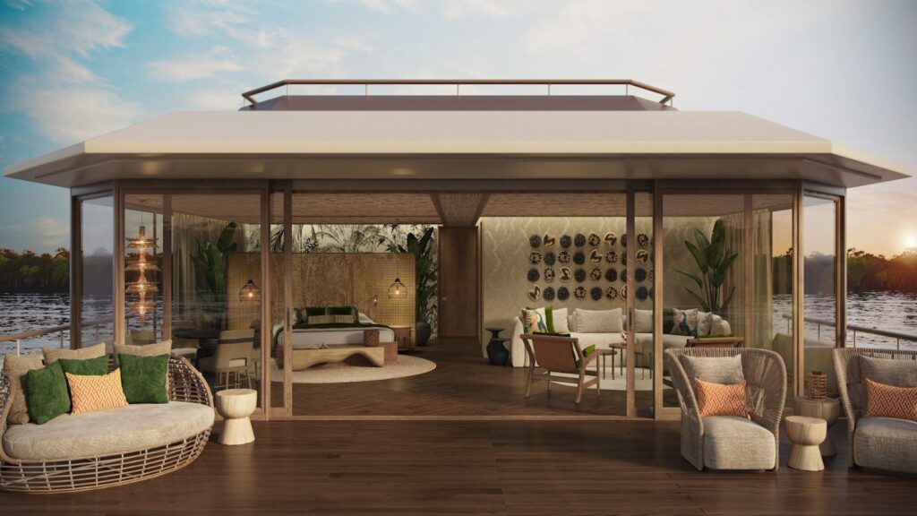 Rendering of the andBeyond Amazon Explorer Deluxe Suite, with a bed and sitting area behind glass walls opening onto a furnished private deck at sunset