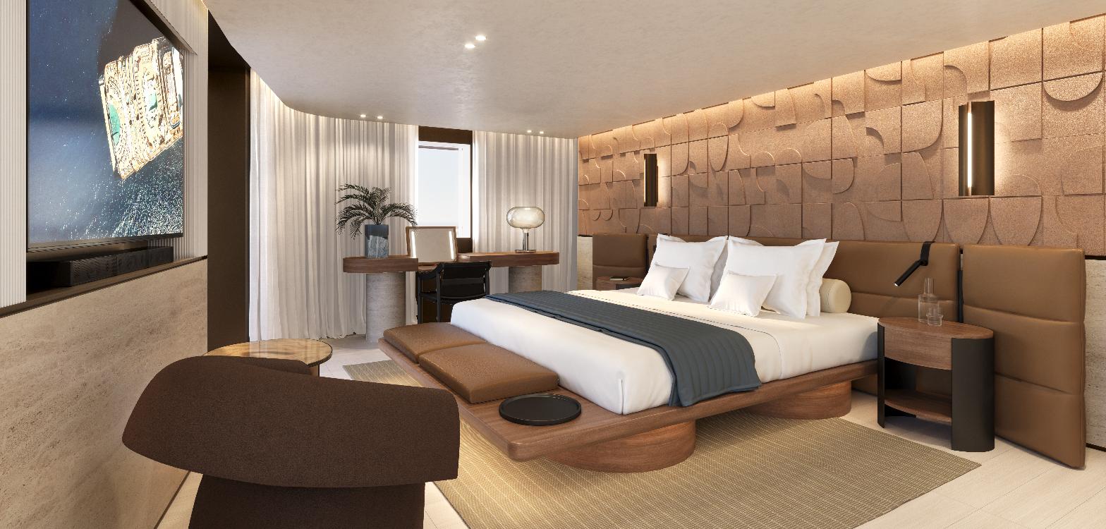 The second Owner's Residence on EXPLORA III, designed by Patricia Urquiola: a low walnut platform bed against a sculpted bronze-toned relief wall, with tan leather panelling, a writing desk and floor-to-ceiling curtains