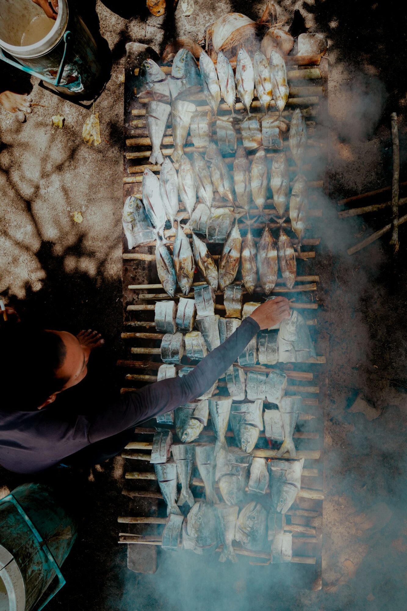Fresh fish grilling over coals on the beach in Lovina