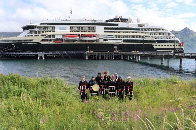No Cruise Ship Had Ever Called at Old Harbor. In August, One Did. The first Old Harbor Alaska cruise call: MS Roald Amundsen alongside the pier at Old Harbor, with Alutiiq dancers in traditional regalia standing in the fireweed on the shore in front of the ship