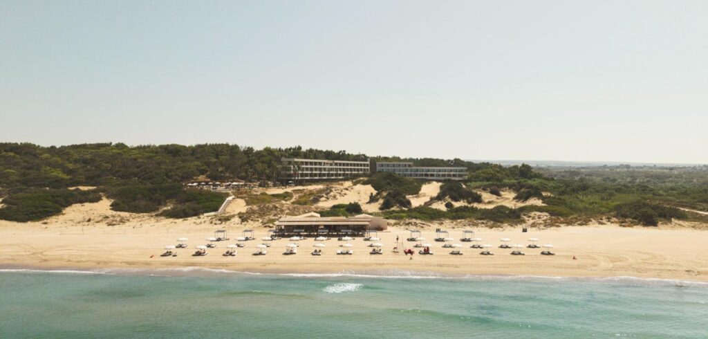 Icona’s Costa Ragusa Resort seen from the sea above its private beach, Sicily