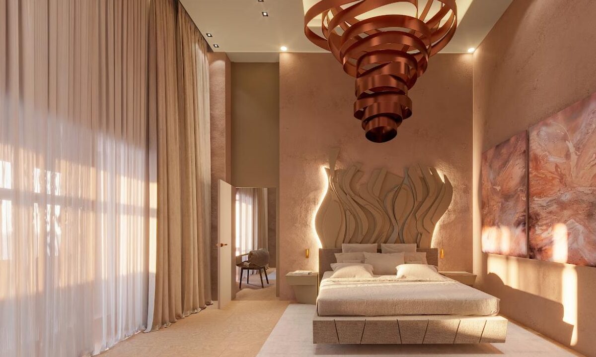 Bedroom in a Solis suite at Iniala Valletta, with a sculpted headboard and copper pendant light