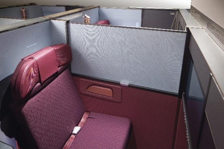 Japan Airlines A350-1000 Business Class private suite with high walls and maroon leather seat