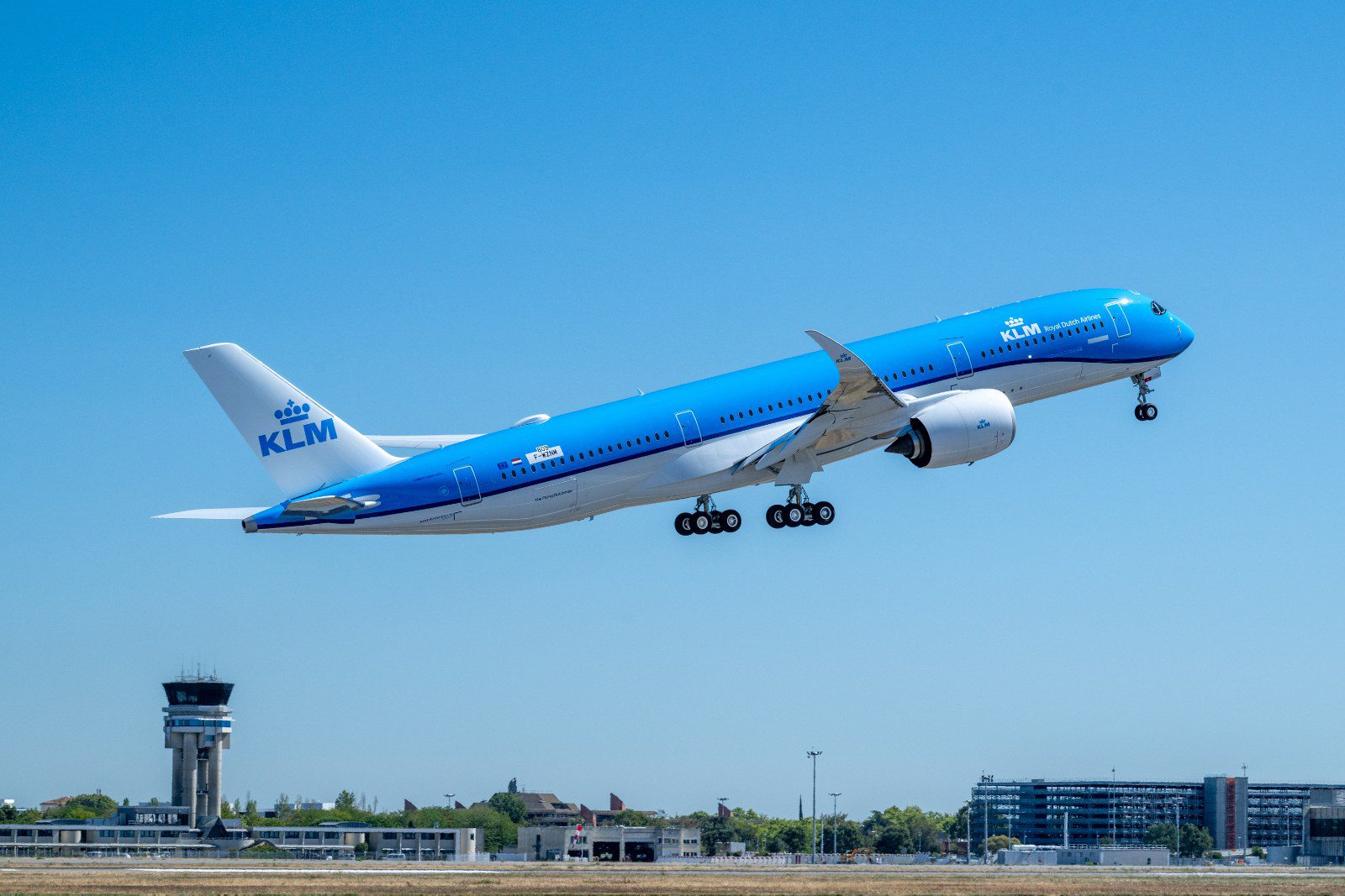 KLM Airbus A350-900 climbing out after take-off on a test flight, landing gear still down