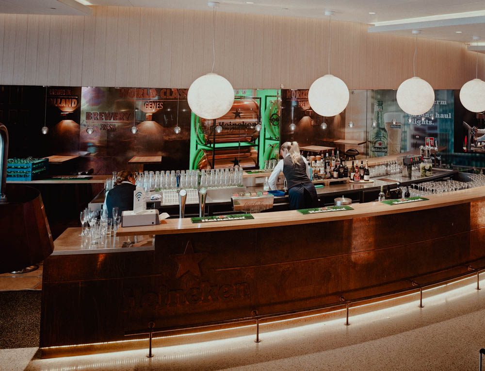 Heineken bar with bartender at KLM Crown Lounge 52, Amsterdam Airport