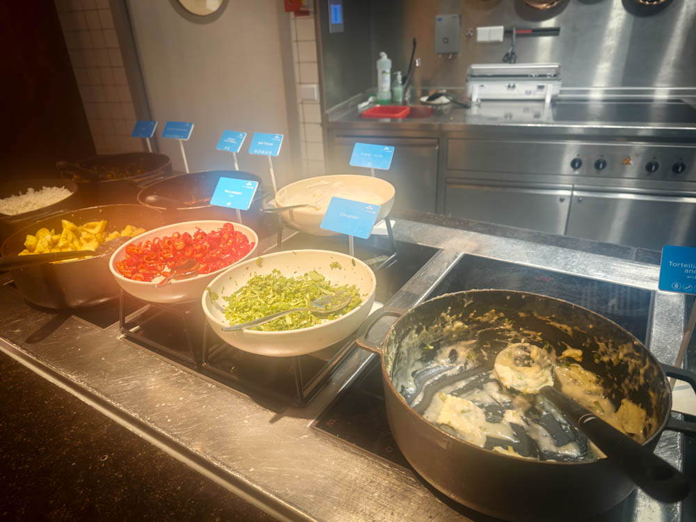 Near-empty tortellini pan at the KLM Crown Lounge 52 buffet in the evening