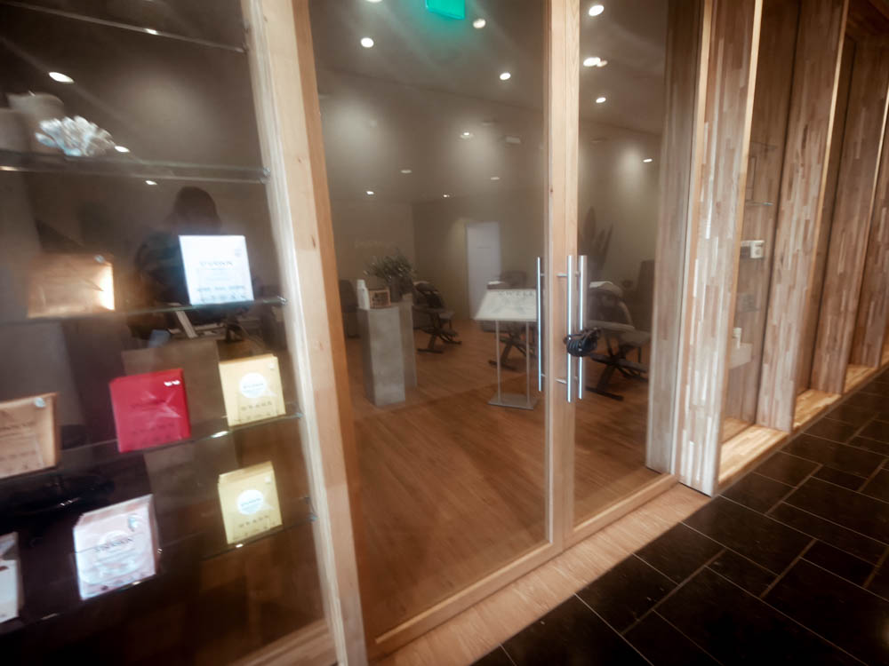 The spa at KLM Crown Lounge 52 behind glass doors — closed during my evening visit