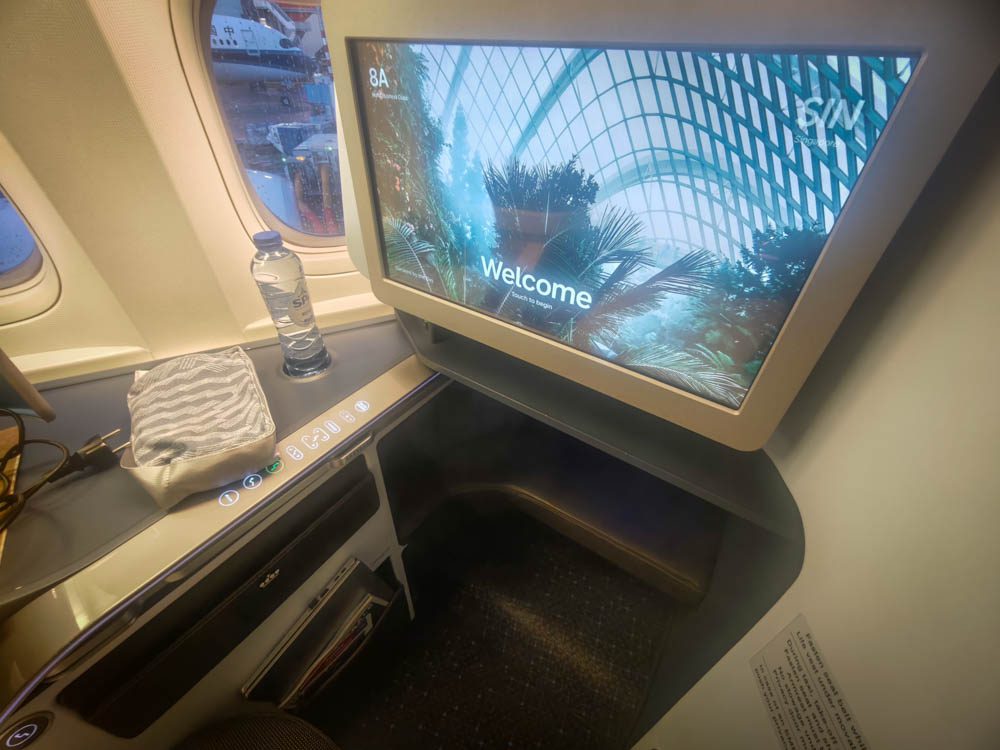 Large entertainment screen showing the welcome page at KLM business class seat 8A