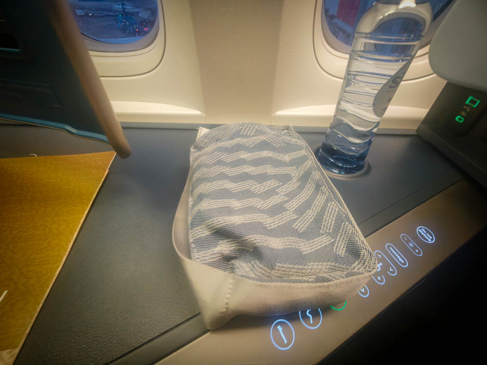 KLM business class amenity kit pouch on the seat console