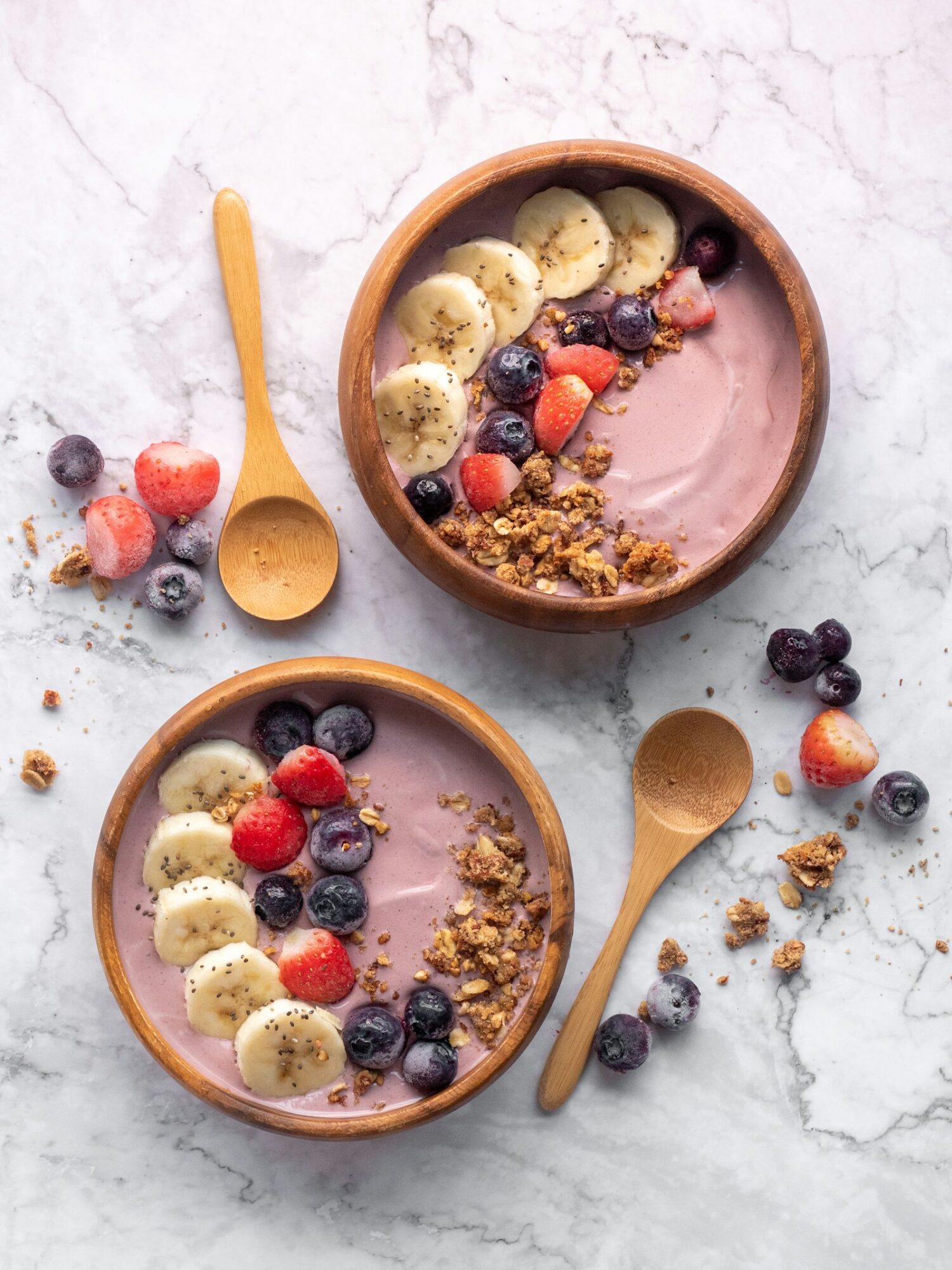 Acai bowls with banana, berries and granola at a plant-based cafe