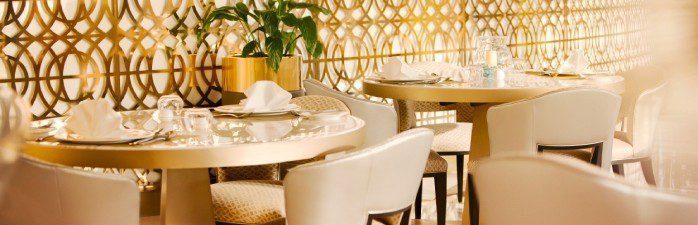 Dining tables in the Oman Air First and Business Class lounge at Muscat International Airport