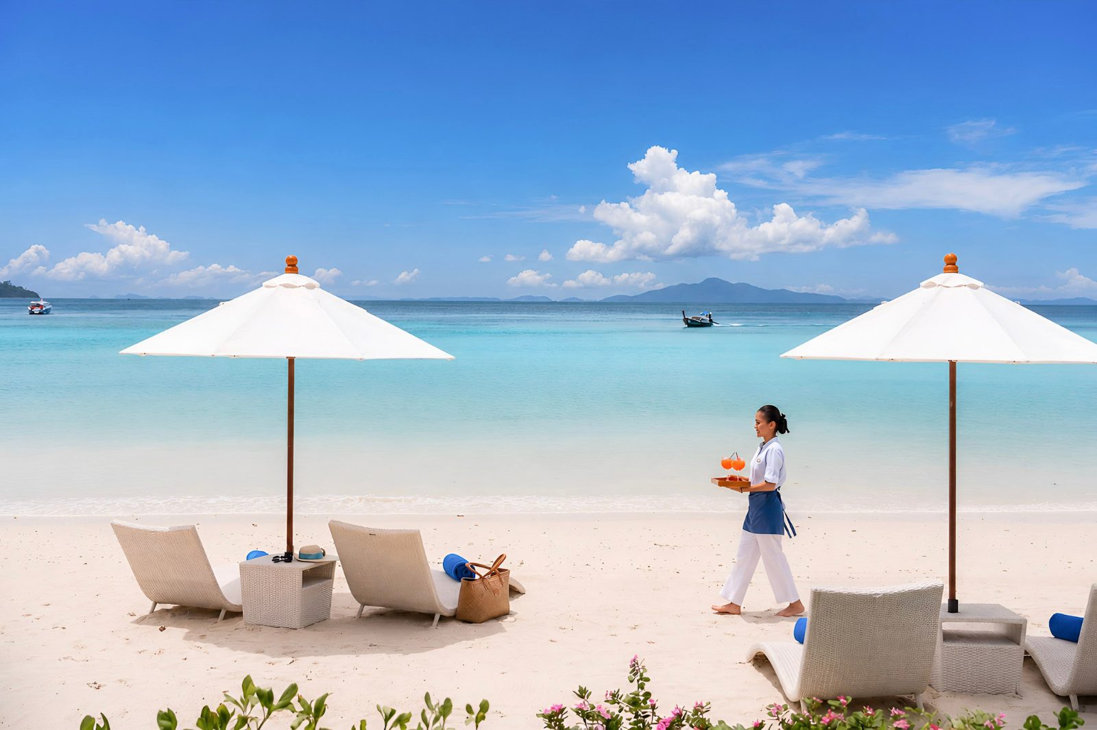 Outrigger Phi Phi Island Resort beach and longtail boats, Thailand