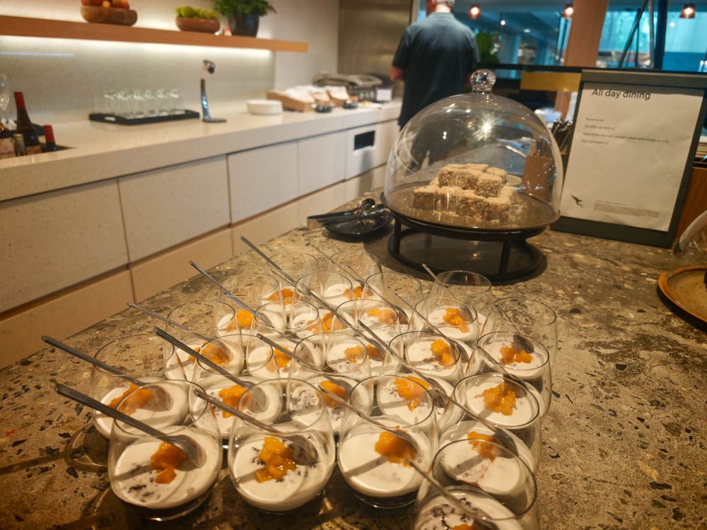 Lamingtons and coconut-mango panna cotta at the Qantas lounge dessert counter, Singapore