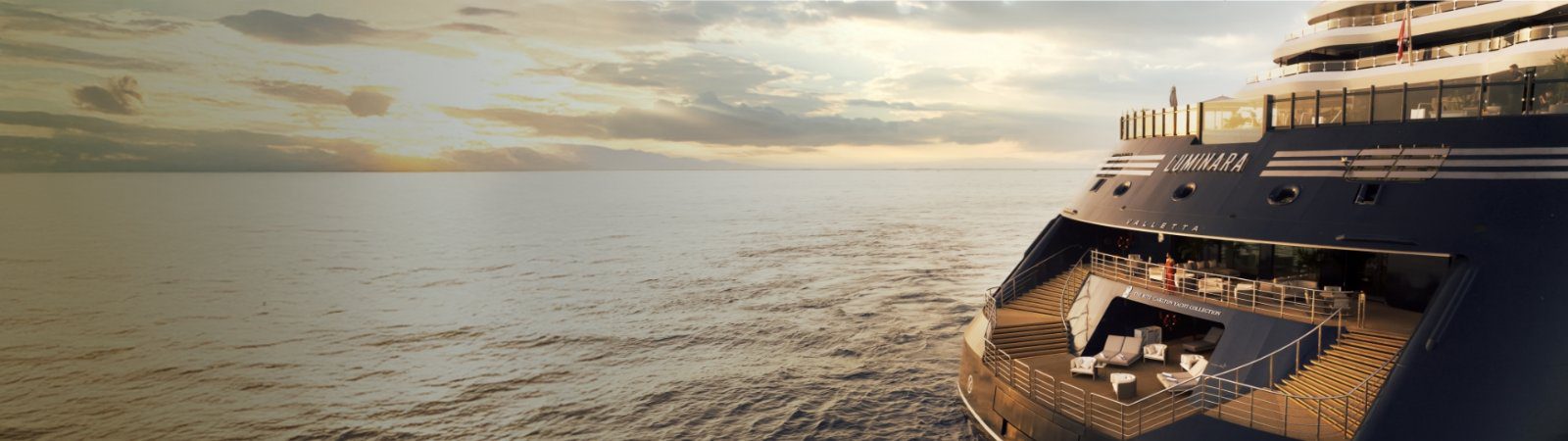 The tiered aft decks of Luminara at sunset, with sun loungers and seating on curved teak terraces above the wake