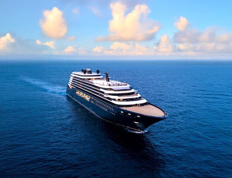 Ritz-Carlton Took Its Yacht to Alaska for the First Time — and Went to the Ports Big Ships Skip Luminara under way on open blue water, seen from the air off her port bow, with tiered white decks above a dark hull