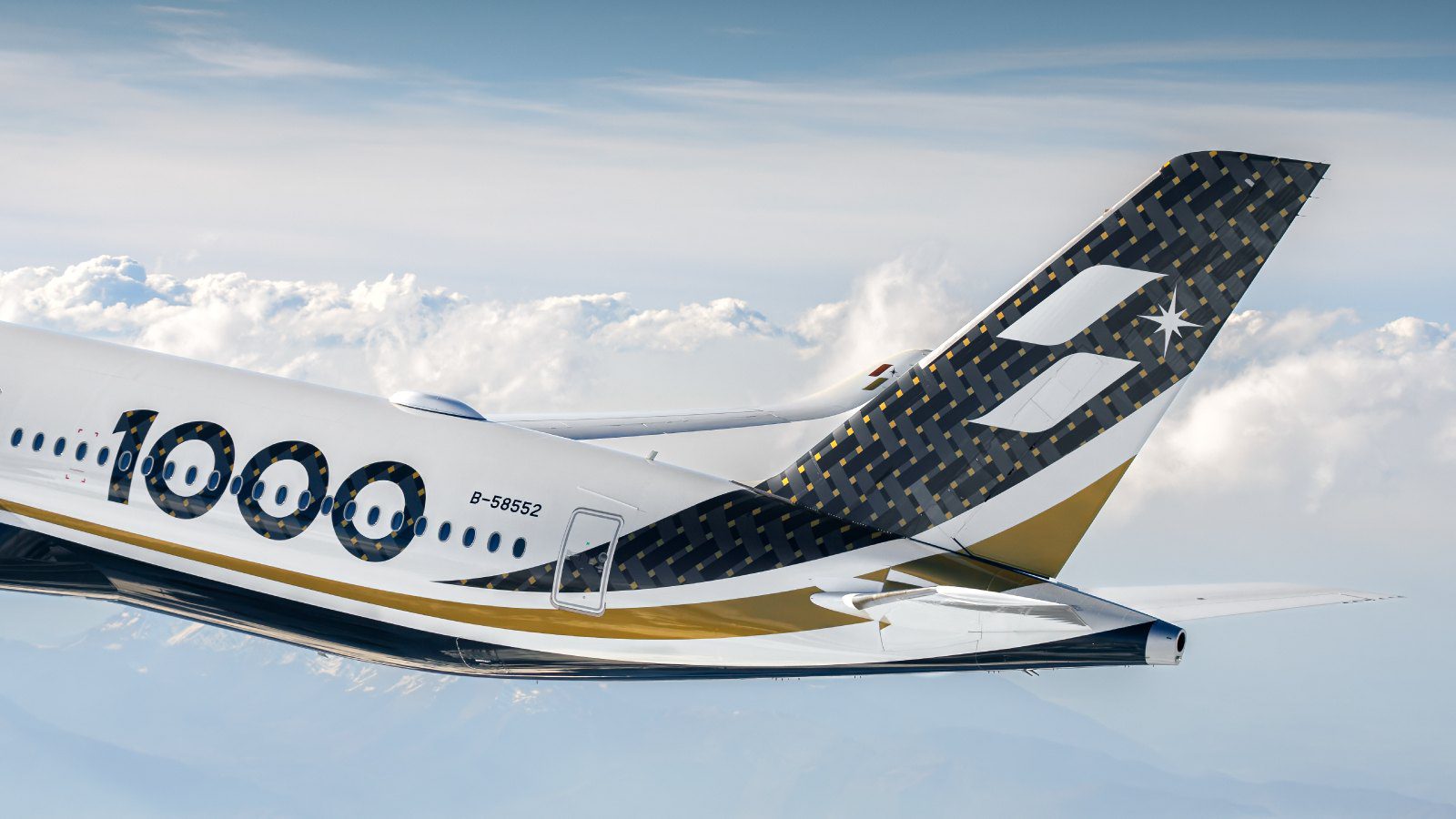 Tail and wing of a STARLUX Airbus A350-1000 showing the 1000 fuselage marking