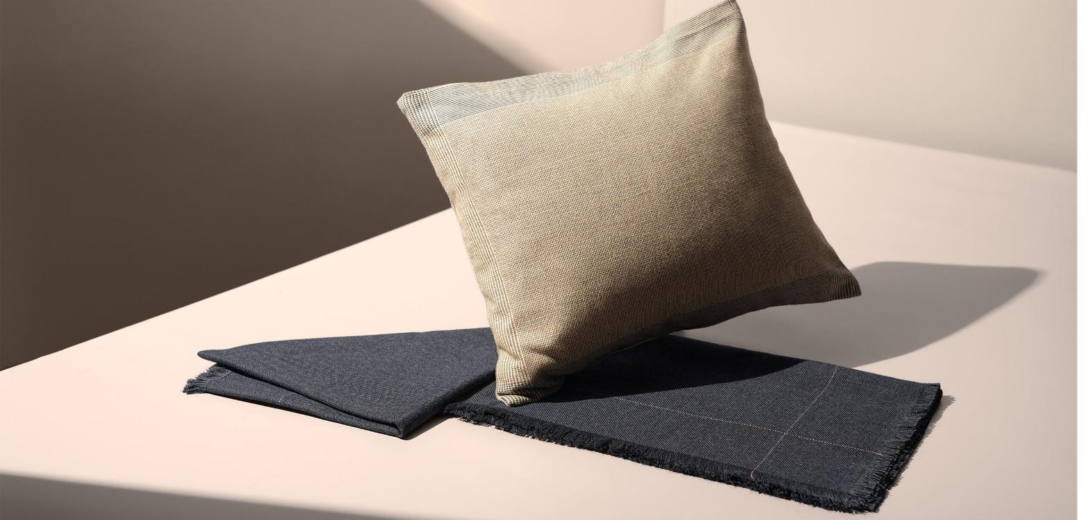 SWISS First cushion and folded throw from the Senses bedding collection