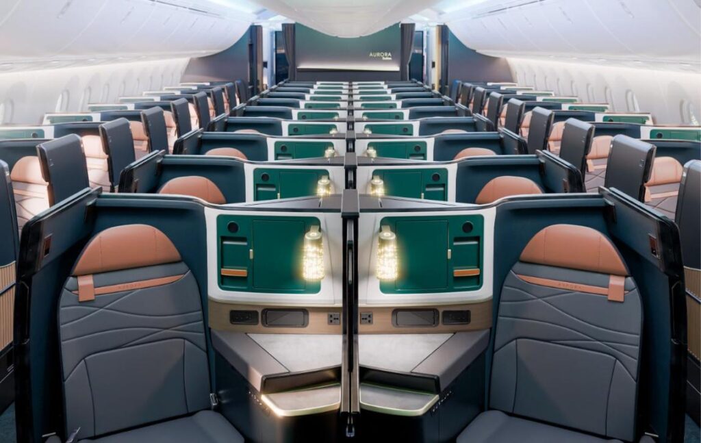 Rendering of the Alaska Airlines 787 Aurora Suites business cabin with dark green shells, tan leather headrests and lit centre dividers