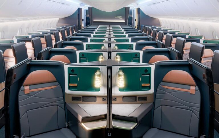 Rendering of the Alaska Airlines 787 Aurora Suites business cabin with dark green shells, tan leather headrests and lit centre dividers