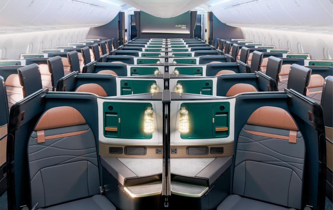 Rendering of the Alaska Airlines 787 Aurora Suites business cabin with dark green shells, tan leather headrests and lit centre dividers