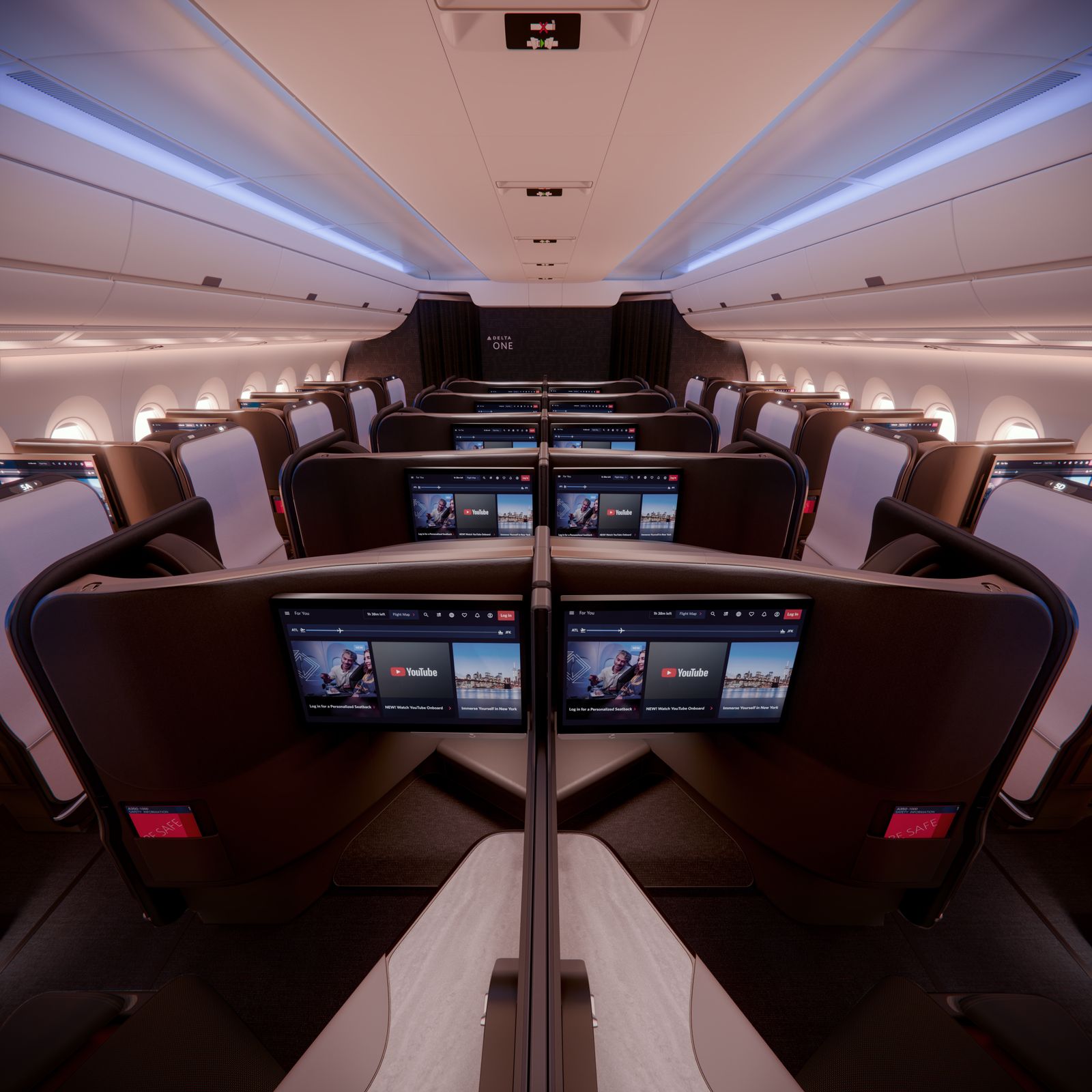 Rendering of the Delta One Suite cabin on Delta’s Airbus A350-1000, looking forward over rows of enclosed suites and screens