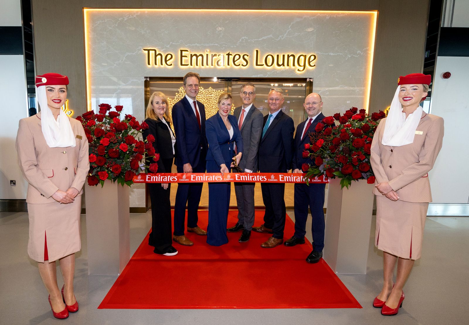 Emirates executives and cabin crew cutting the ribbon at the opening of The Emirates Lounge in Manchester